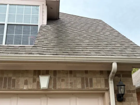Shingle roof before soft washing, showing streaks